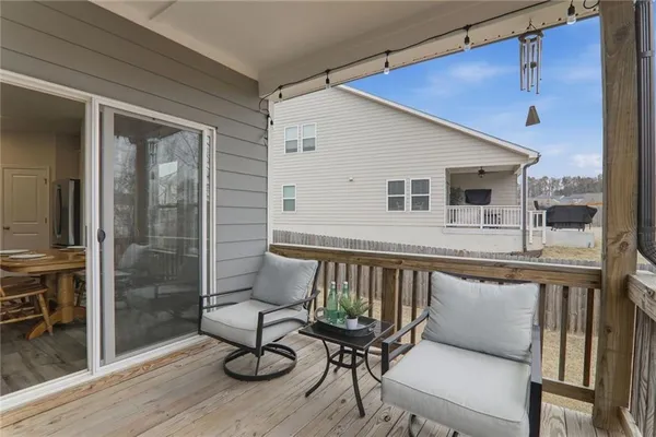 a view of a chair and table in the balcony