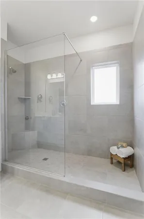 a bathroom with a shower and a toilet