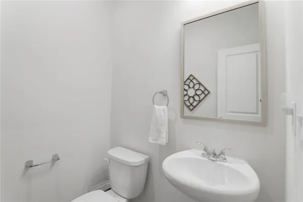 a bathroom with a toilet and a sink