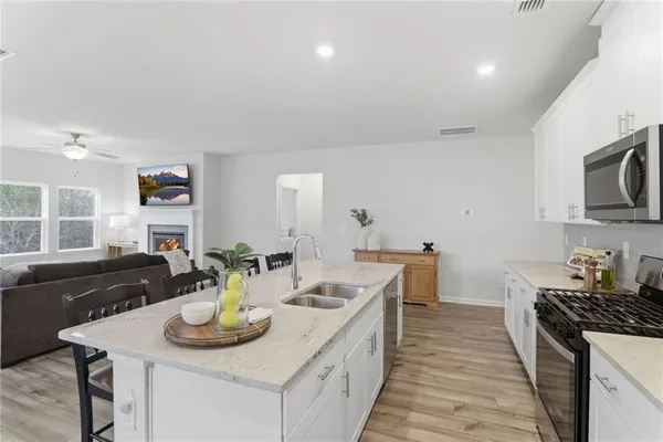 a kitchen that has a sink and a stove