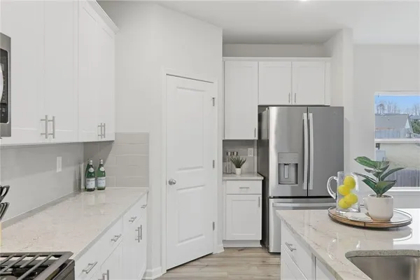 a kitchen with cabinets and stainless steel appliances