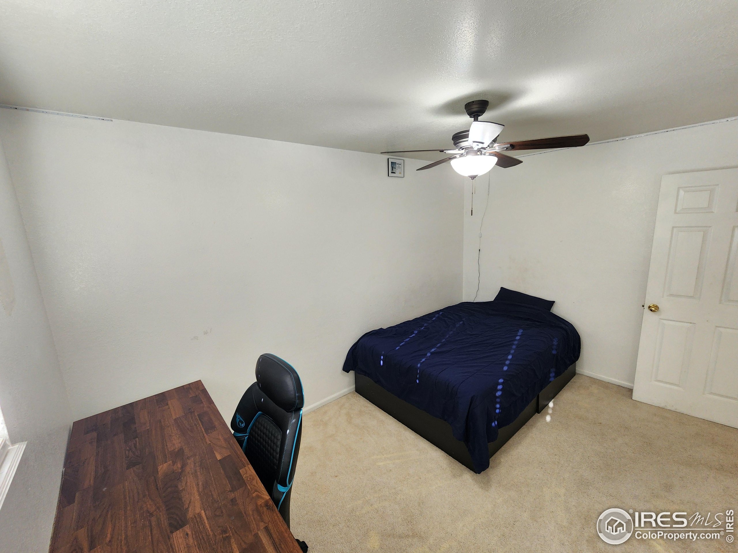 1324 Dawes Street Sterling, CO 80751 - Photo 15 of 39 a living room with furniture and a ceiling fan