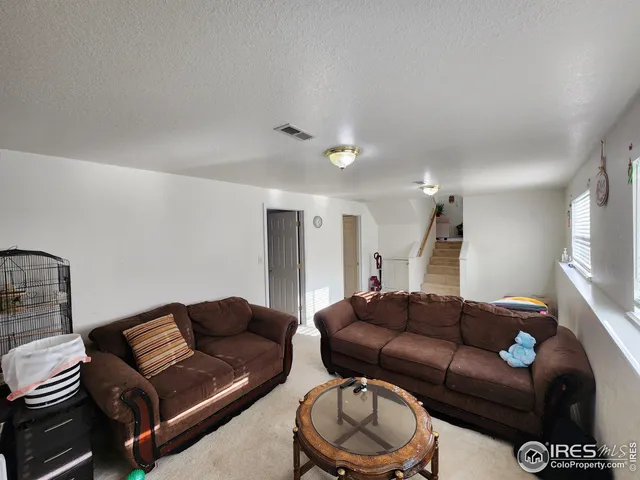 a living room with furniture and a couch