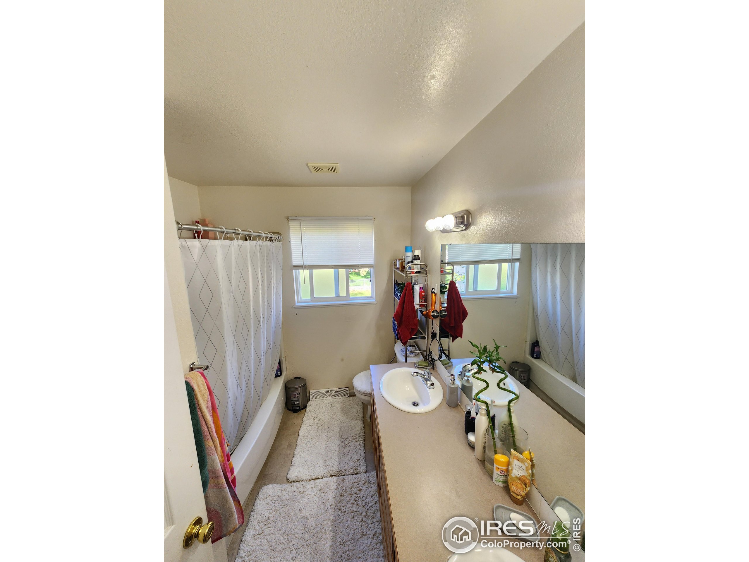 1324 Dawes Street Sterling, CO 80751 - Photo 21 of 39 a view of a dining room with furniture and a chandelier