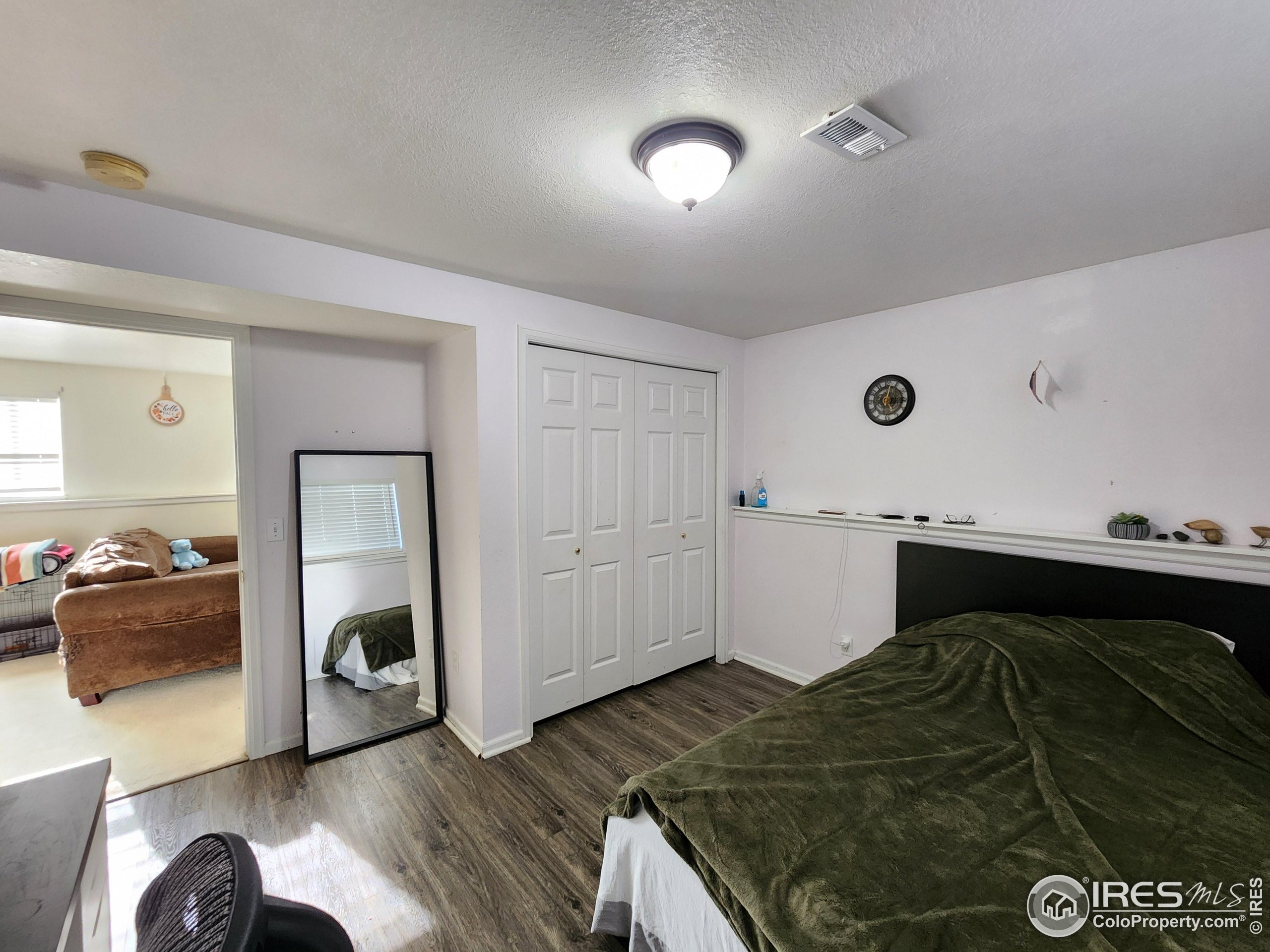 1324 Dawes Street Sterling, CO 80751 - Photo 25 of 39 a bedroom with a bed and a dresser