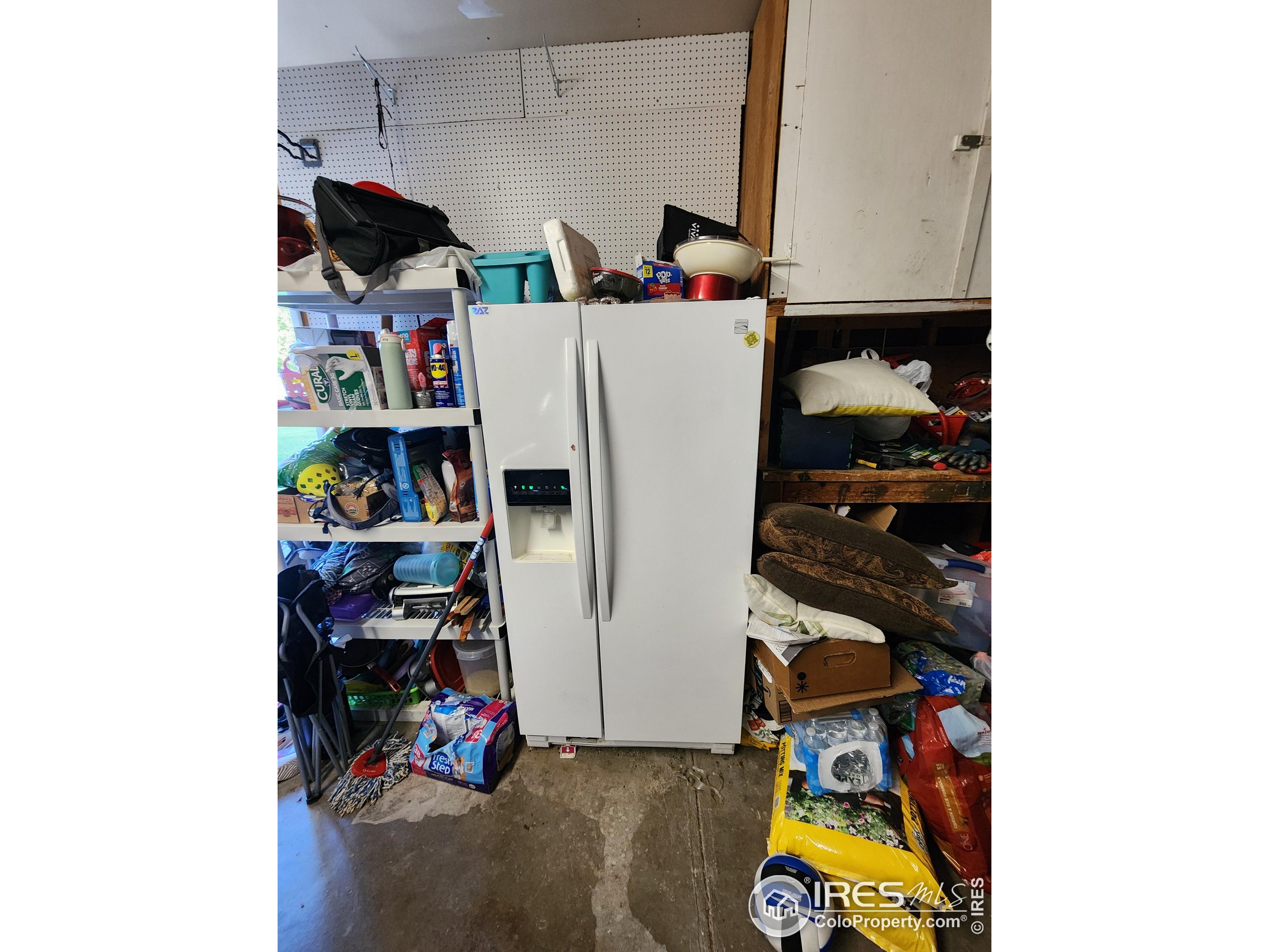 1324 Dawes Street Sterling, CO 80751 - Photo 37 of 39 a view of storage and utility room with two washing machine