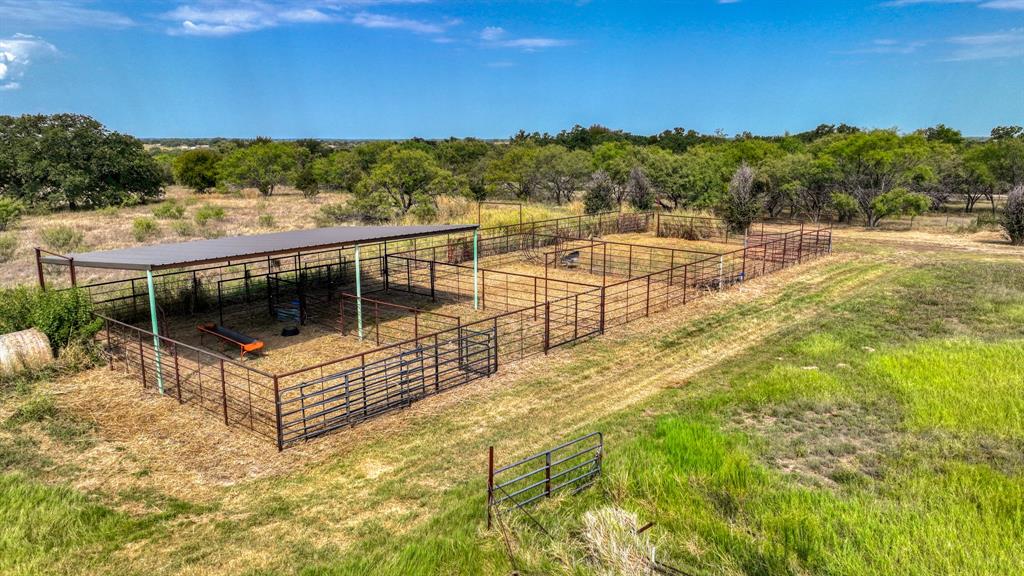 3810 Fairview Road Millsap, TX 76066 - Photo 5 of 25 View of yard with a view of countryside, an exterior structure, and an outdoor structure