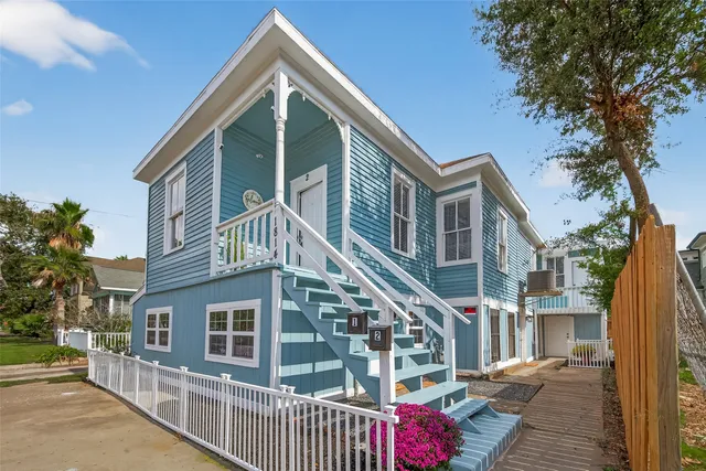 a front view of a house with a small yard