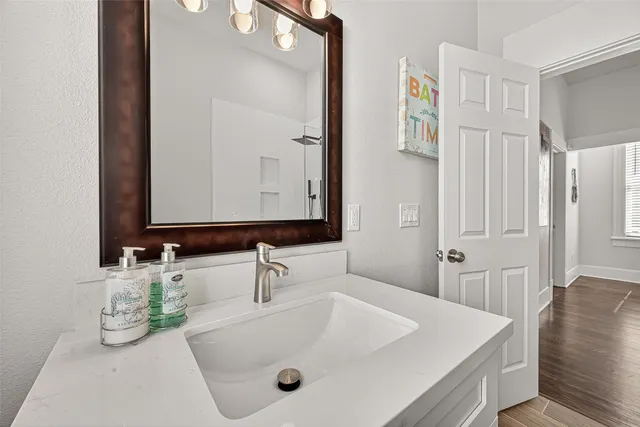 a bathroom with a sink and a mirror