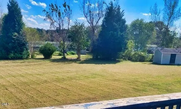 a view of a pool with an outdoor space