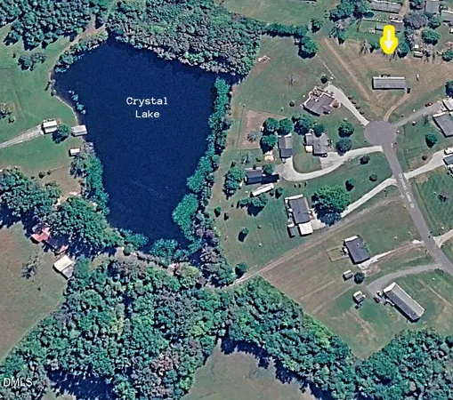 an aerial view of residential house with outdoor space and street view