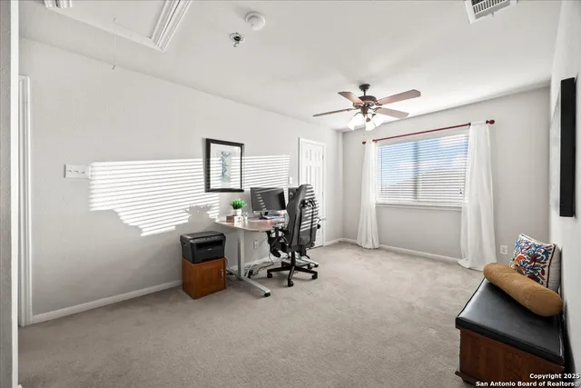 a work room with furniture and a window