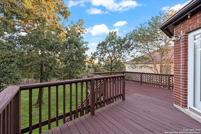 a view of a balcony with wooden floor
