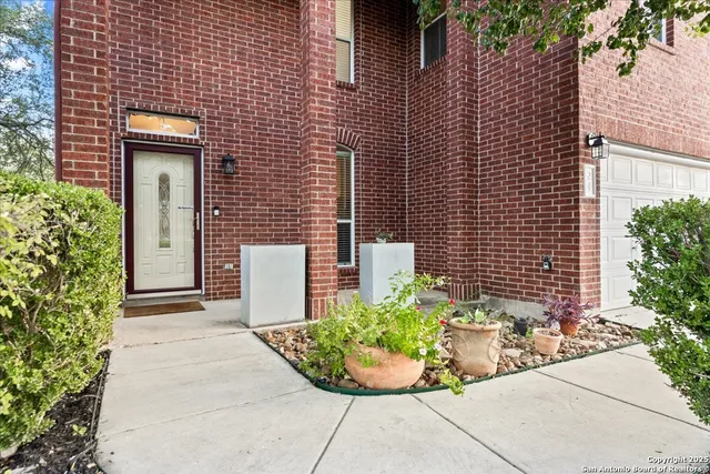 a view of a house with a wooden deck