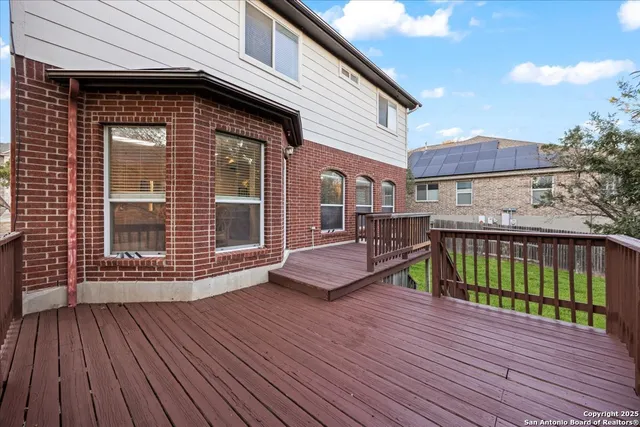 a view of deck with wooden floor and seating space