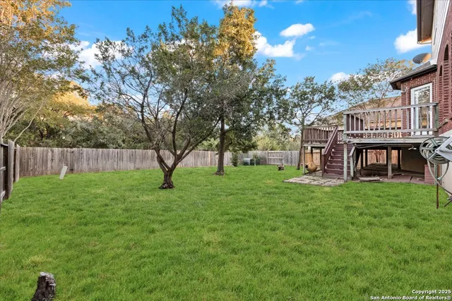 a view of a house with a backyard