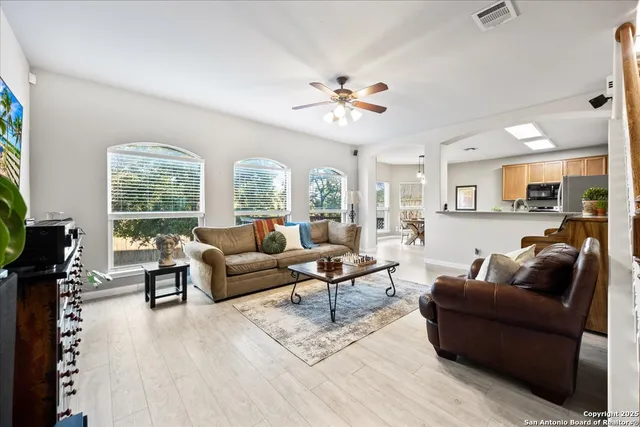 a living room with furniture and a large window