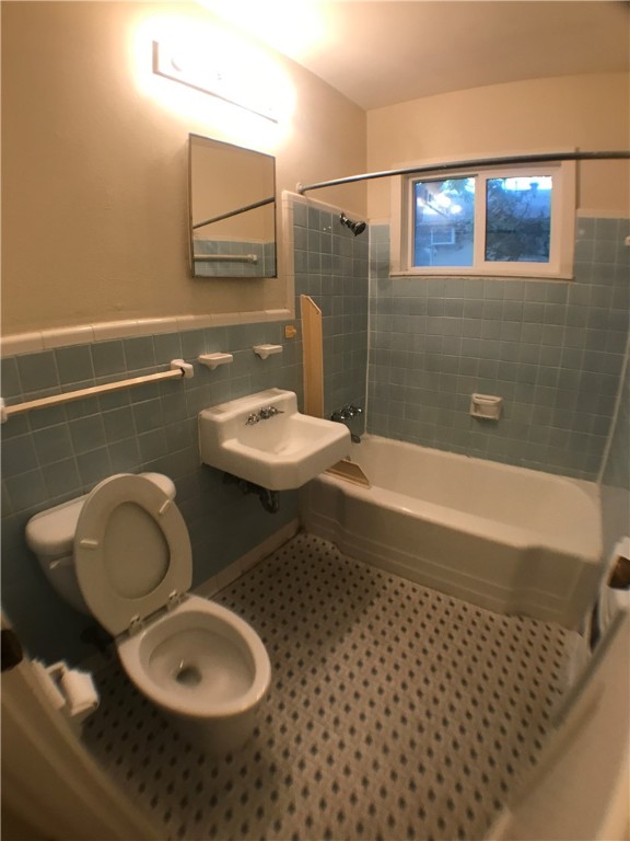 1008 West 25th Street, Unit C Austin, TX 78705 - Photo 10 of 10 a bathroom with a sink and a mirror