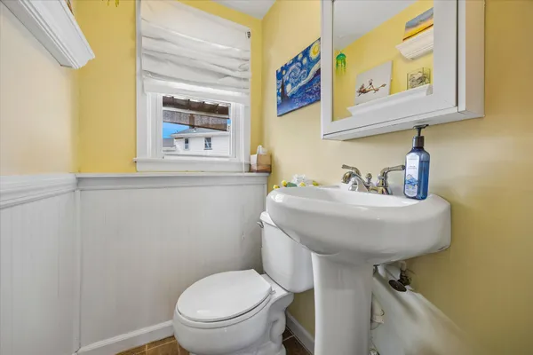 a bathroom with a toilet and a sink