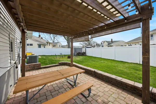 a view of a patio with a yard