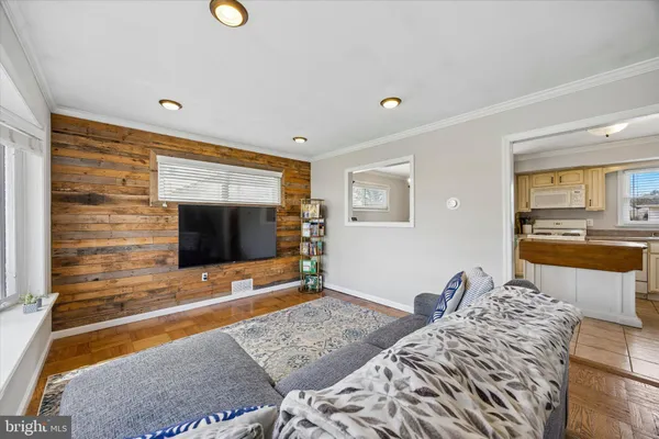 a bedroom with bed and flat screen tv