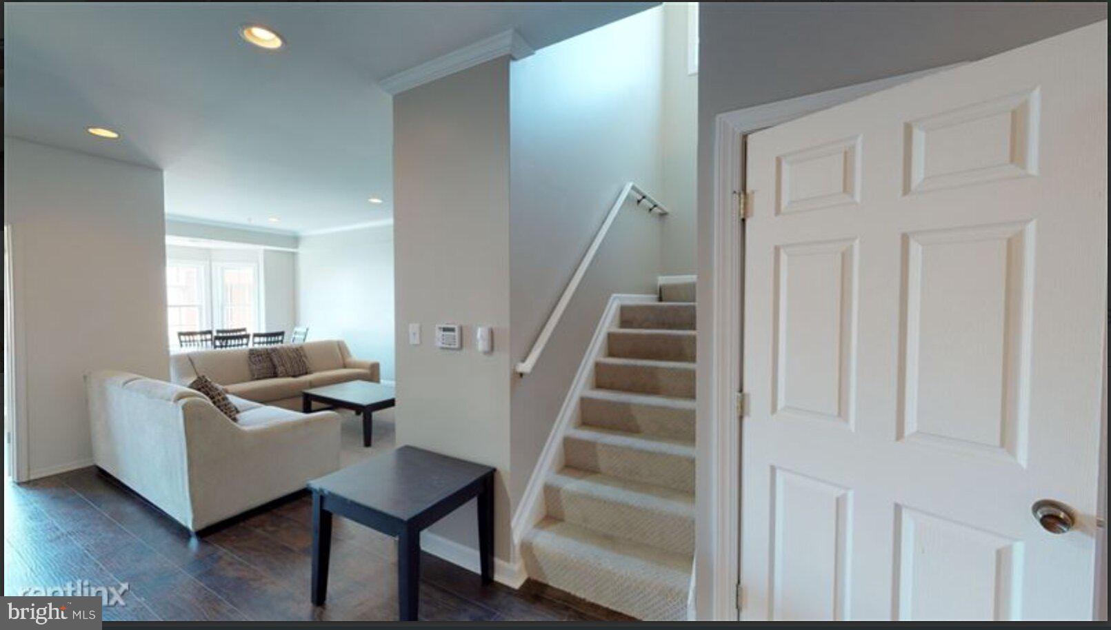 1245 18th Street Northeast, Unit 2 Washington, DC 20002 - Photo 4 of 12 a view of a livingroom with furniture and staircase