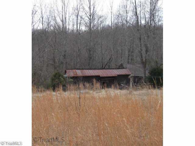 1181 Birthel Bennett Road King, NC 27021 - Photo 4 of 6 Exterior Front. PASTURE. WIRED BUILDING.