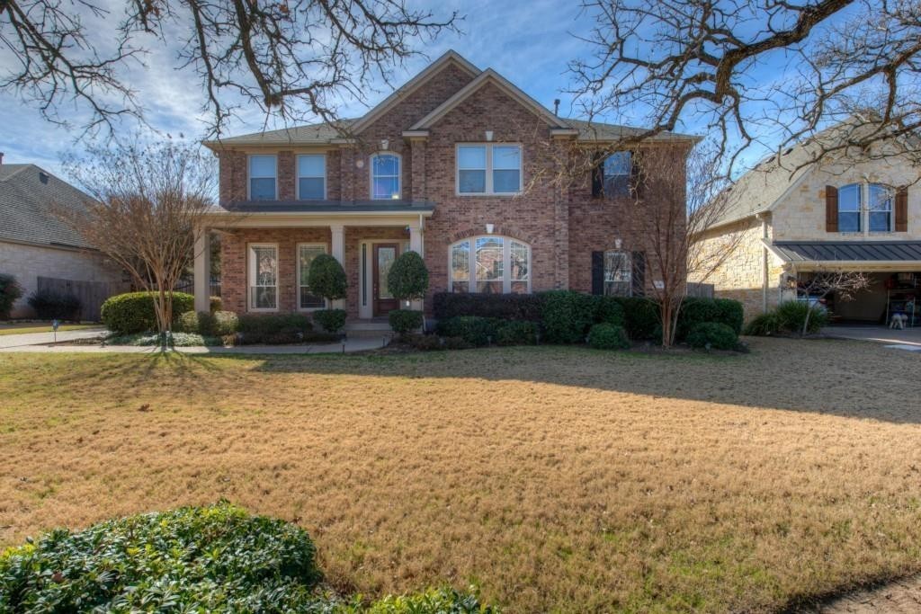 a front view of a house with garden