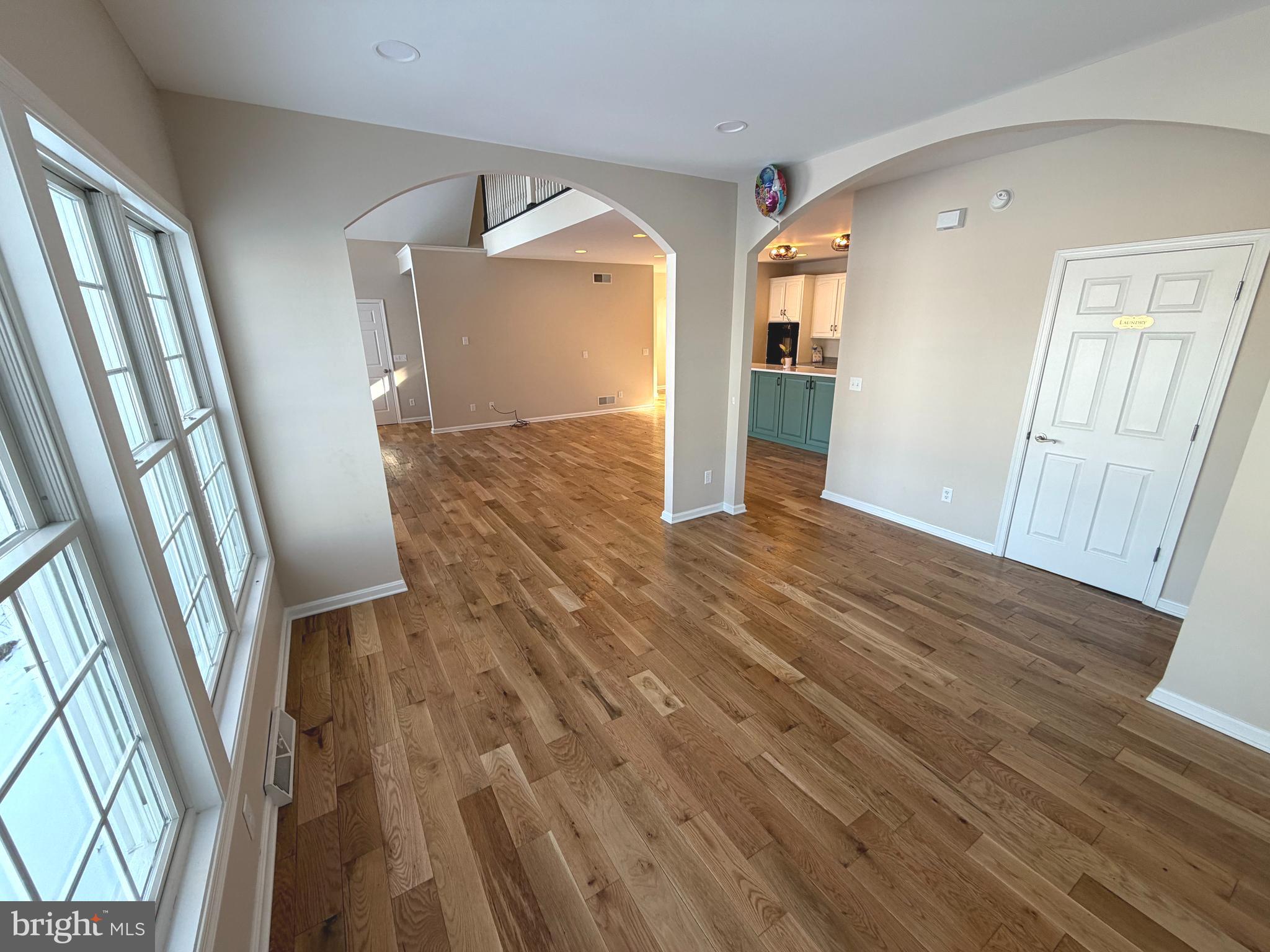 89 South Shore Drive Dover, DE 19901 - Photo 12 of 59 wooden floor in an empty room with a fireplace