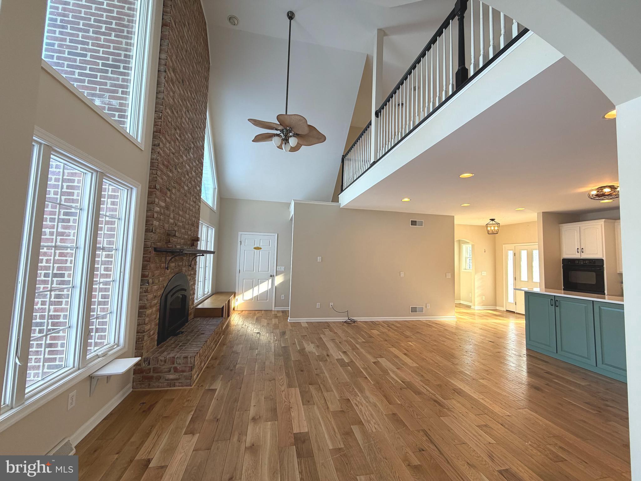 89 South Shore Drive Dover, DE 19901 - Photo 13 of 59 a view of a living room with wooden floor and a kitchen