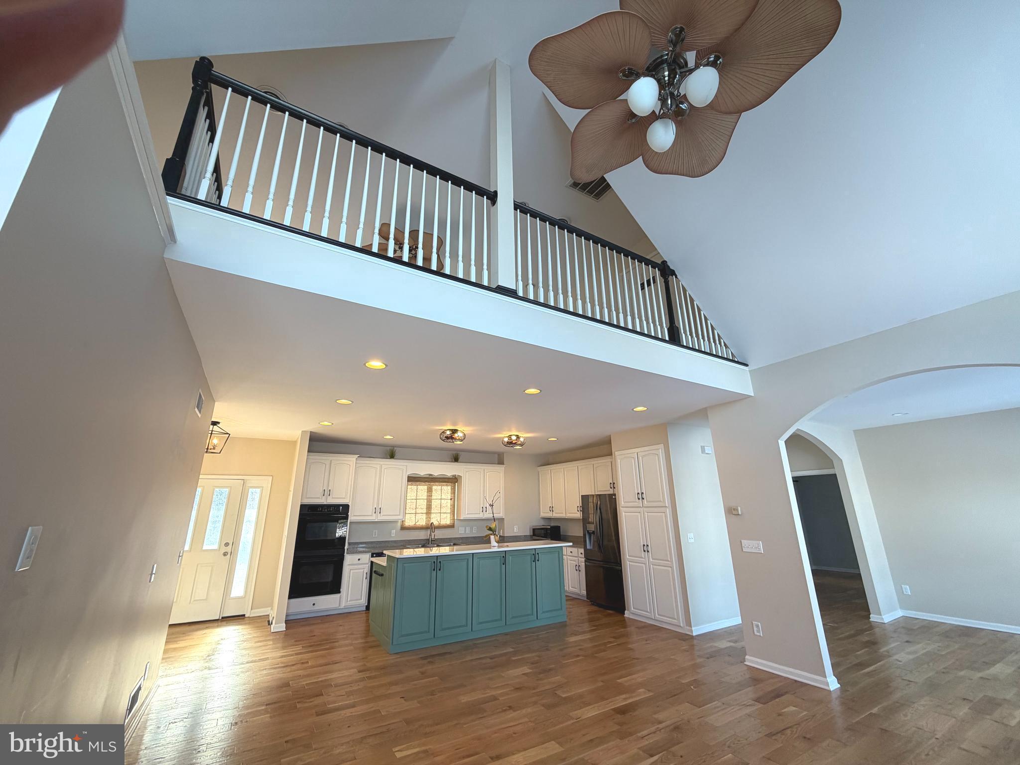 89 South Shore Drive Dover, DE 19901 - Photo 15 of 59 a view of a living room and kitchen with wooden floor