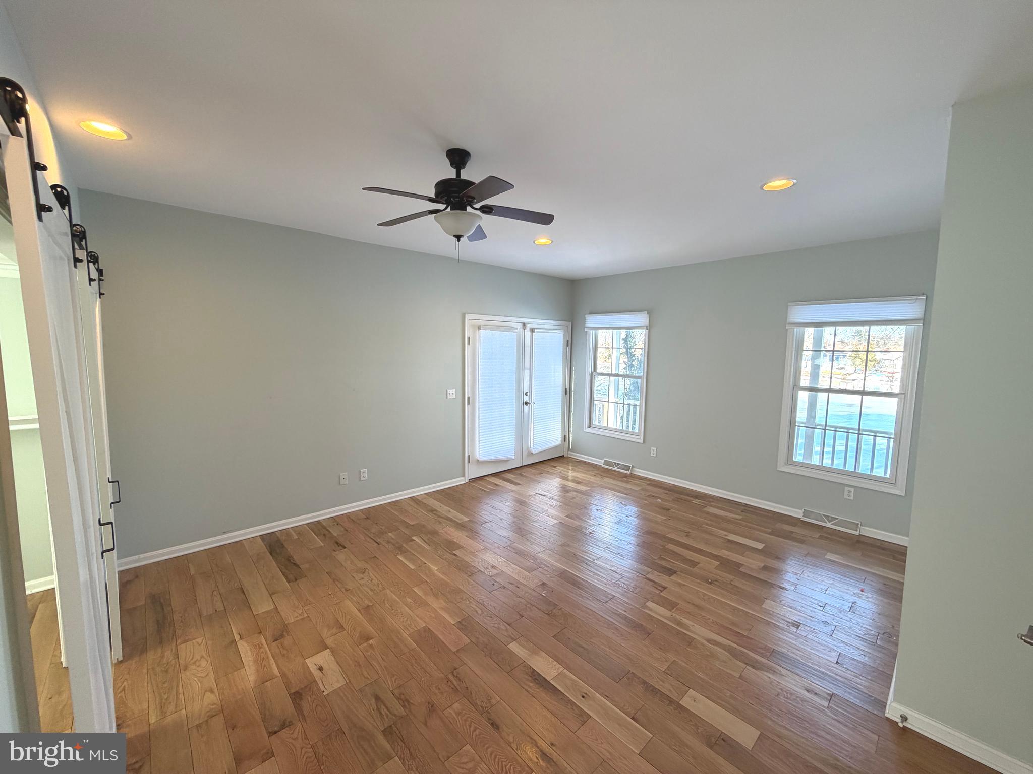 89 South Shore Drive Dover, DE 19901 - Photo 20 of 59 a view of empty room with wooden floor and fan