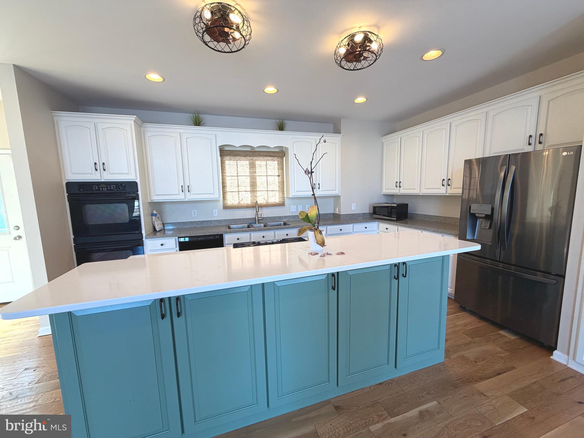 89 South Shore Drive Dover, DE 19901 - Photo 7 of 59 a kitchen with stainless steel appliances granite countertop a sink refrigerator and cabinets