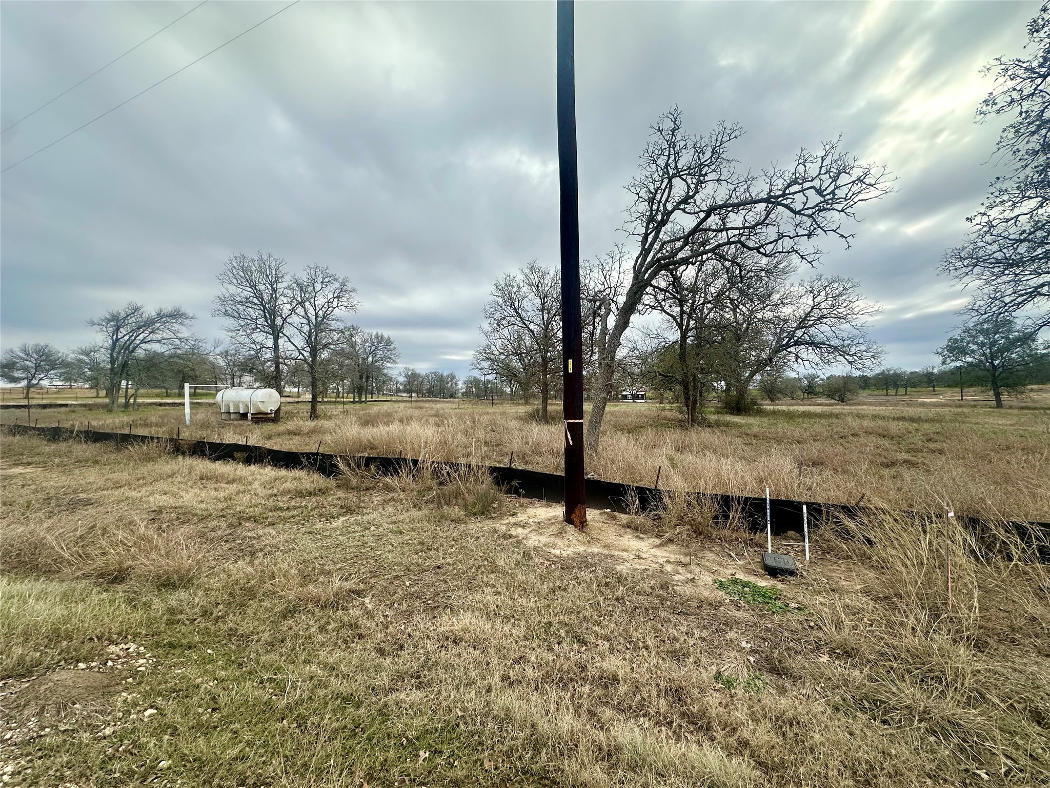 101 Ferguson Loop Dale Dale, TX 78616 - Photo 14 of 16 a view of a lake with a yard