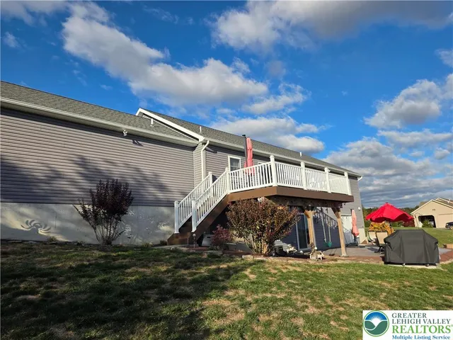 a kitchen with stainless steel appliances granite countertop a stove microwave and sink