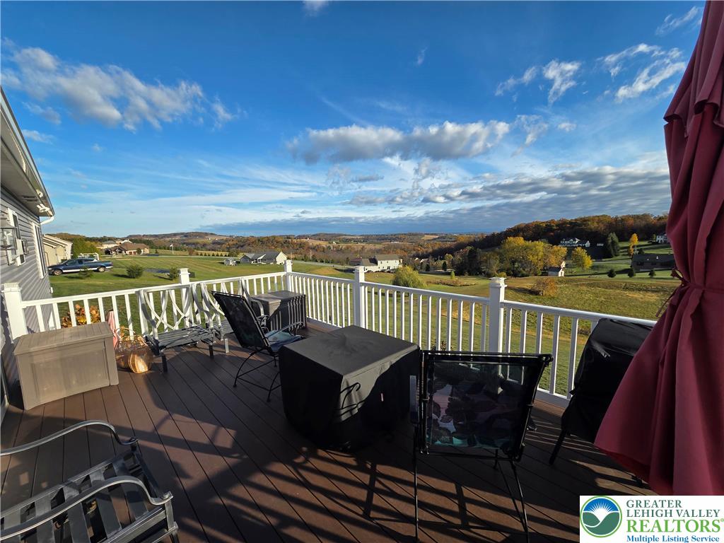 3393 Crestview Lane Walnutport, PA 18088 - Photo 15 of 68 a view of a balcony with lake view and wooden floor