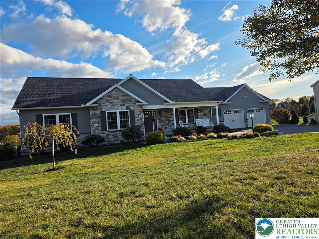 3393 Crestview Lane Walnutport, PA 18088 - Photo 2 of 68 a front view of a house with a yard