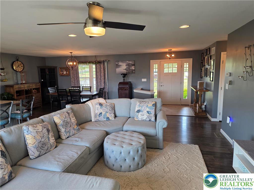3393 Crestview Lane Walnutport, PA 18088 - Photo 26 of 68 a living room with furniture and a chandelier