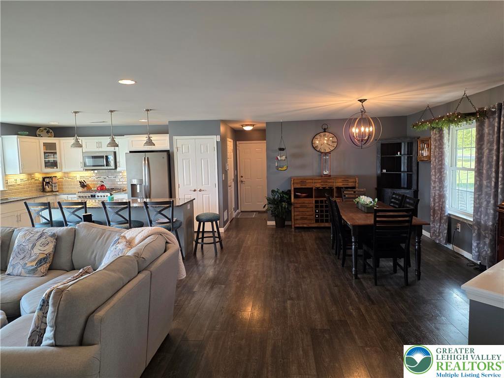 3393 Crestview Lane Walnutport, PA 18088 - Photo 29 of 68 a living room with furniture kitchen view and a wooden floor