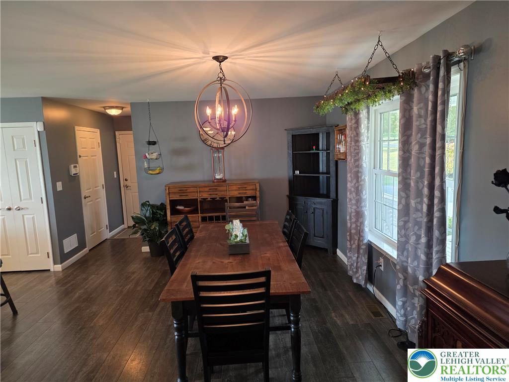 3393 Crestview Lane Walnutport, PA 18088 - Photo 34 of 68 a view of a dining room with furniture wooden floor and chandelier