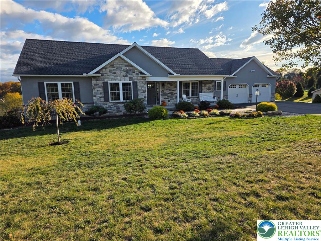 3393 Crestview Lane Walnutport, PA 18088 - Photo 4 of 68 a front view of a house with yard and green space