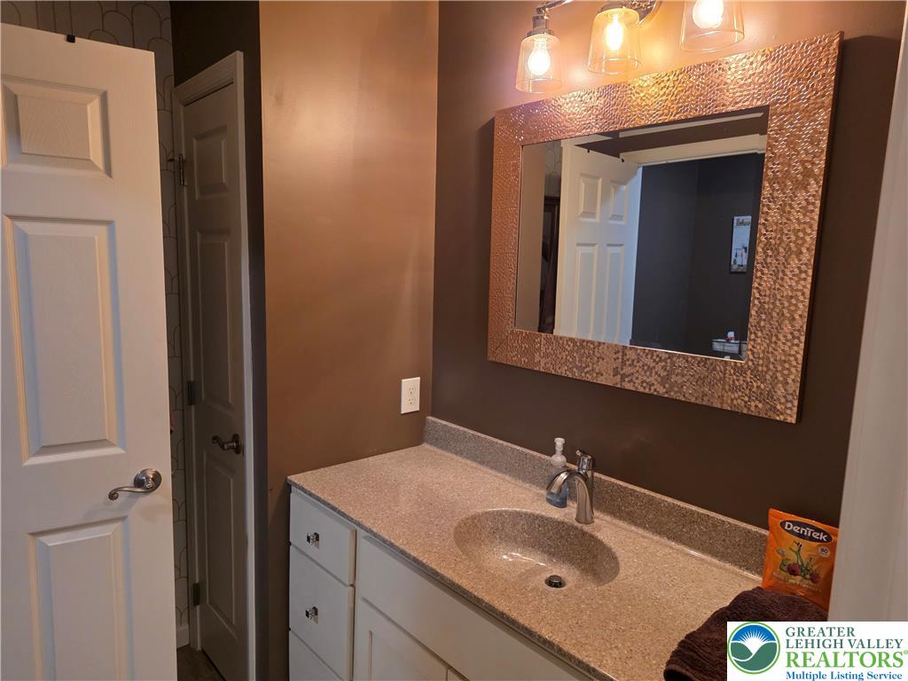 3393 Crestview Lane Walnutport, PA 18088 - Photo 49 of 68 a bathroom with a sink and a mirror