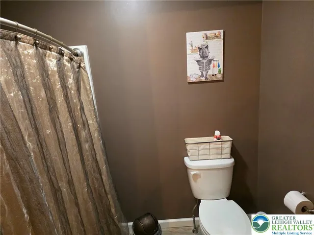 a view of a chairs and table in backyard of the house