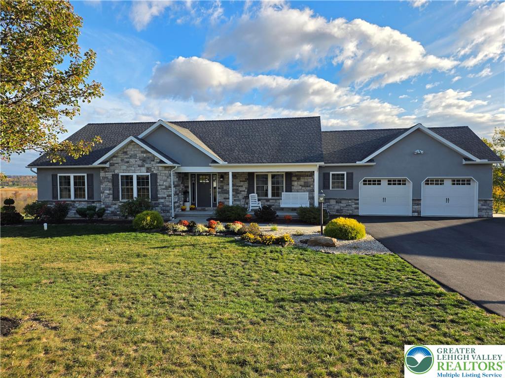 3393 Crestview Lane Walnutport, PA 18088 - Photo 5 of 68 a front view of house with yard fire pit and outdoor seating