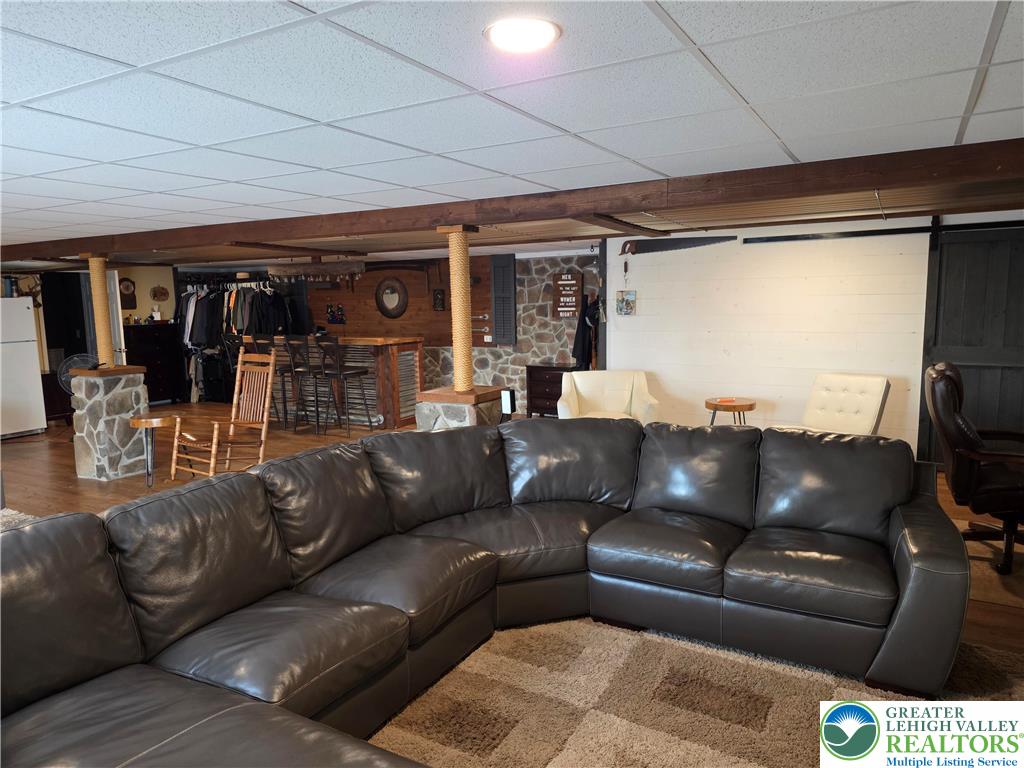 3393 Crestview Lane Walnutport, PA 18088 - Photo 54 of 68 a living room with a couch and a flat screen tv