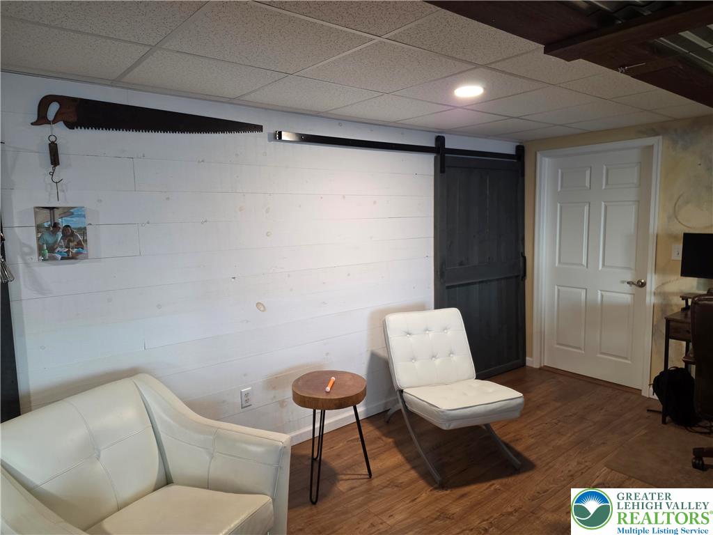3393 Crestview Lane Walnutport, PA 18088 - Photo 55 of 68 a living room with furniture and a wooden floor