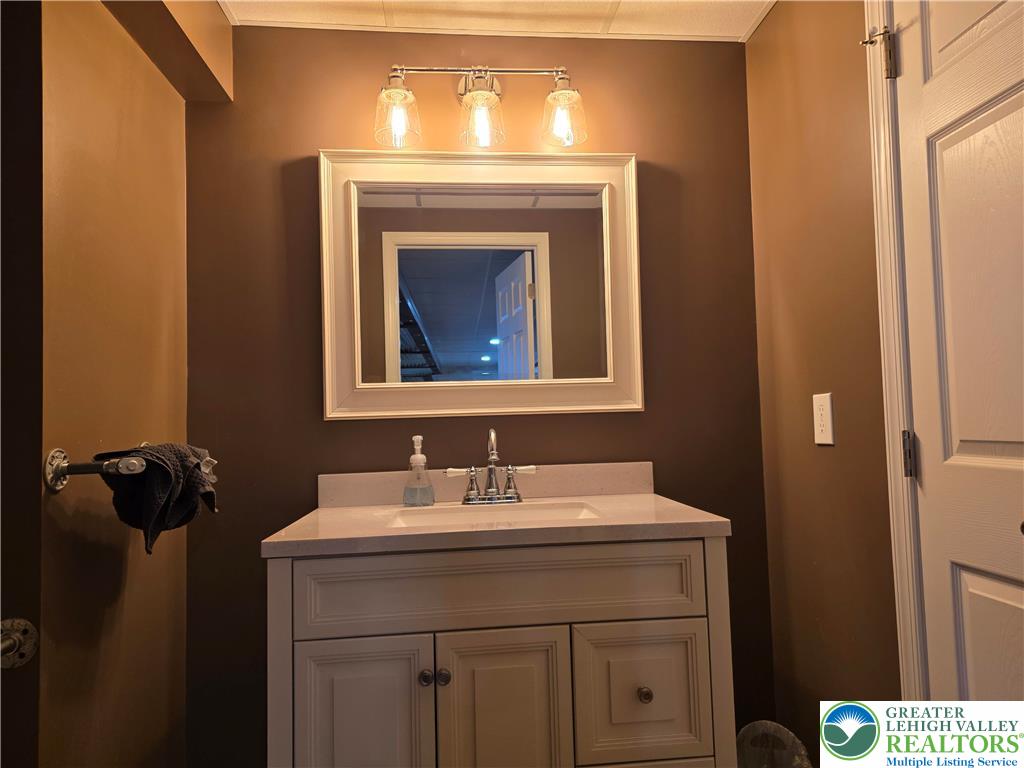 3393 Crestview Lane Walnutport, PA 18088 - Photo 59 of 68 a bathroom with a sink and a mirror