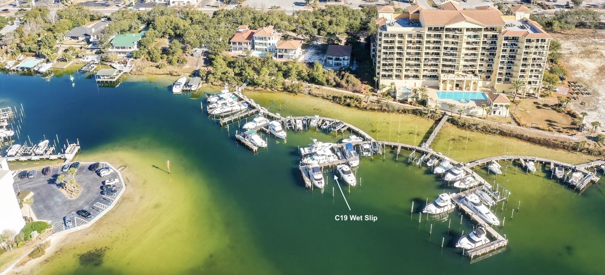 an aerial view of residential houses with outdoor space and swimming pool