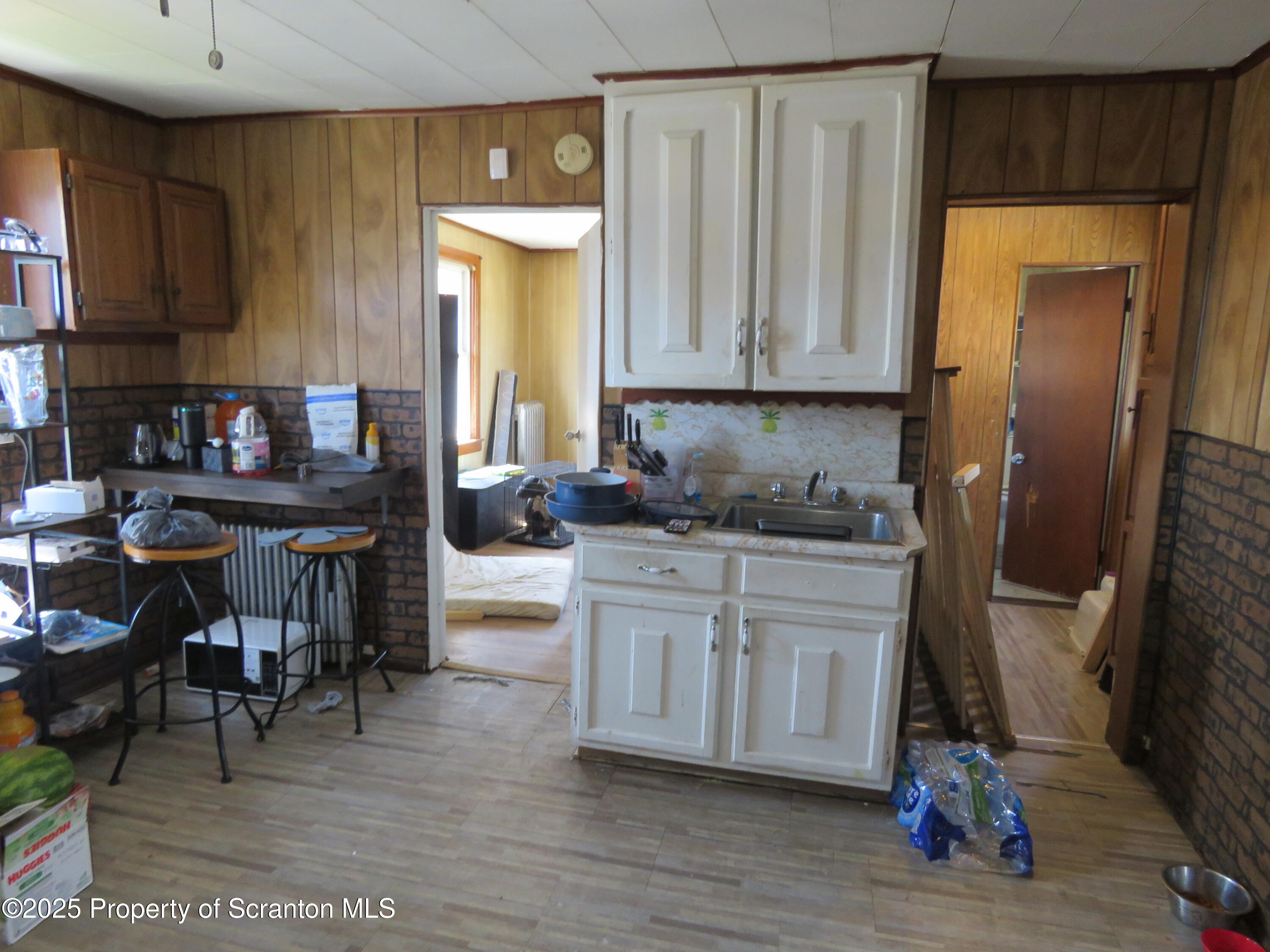 16 Hospital Street Carbondale, PA 18407 - Photo 12 of 16 a kitchen with stainless steel appliances granite countertop a refrigerator sink and cabinets