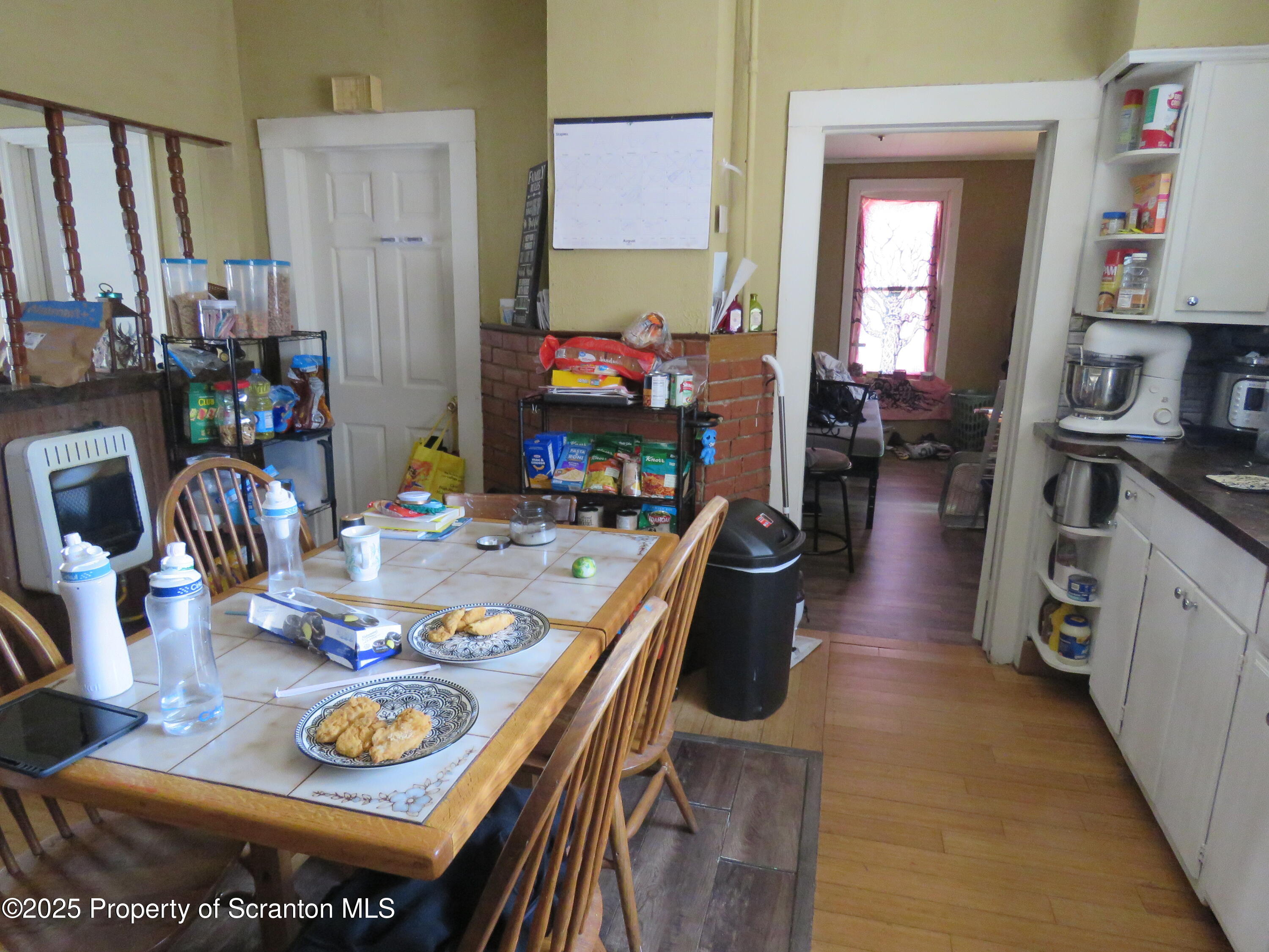 16 Hospital Street Carbondale, PA 18407 - Photo 3 of 16 a view of a dining room with furniture and a kitchen